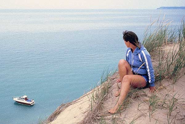 Sandy Steele Sits on Top of the Sleeping Bear Dunes